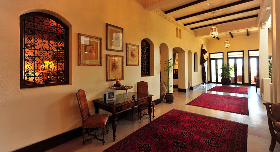 Rustic contextual interiors with bespoke furniture and lighting in the Central Building of the Al Maha Desert Resort designed by RTAE, Dubai